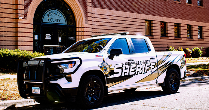 Sheriff's vehicle in front of county building